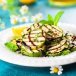 Grilled zucchini with herbs dressing, balsamic sauce and olive oil.