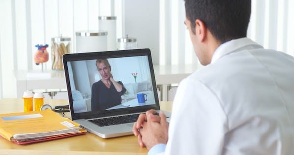 Man video chatting with doctor