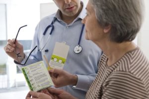 older woman talking to doctor