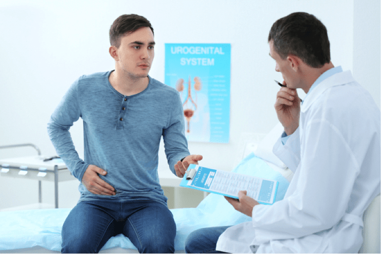a young man holding his stomach and talking to a doctor about his symptoms